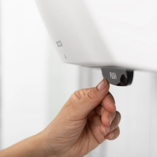 84739_katrin_system_hand_towel_roll_dispenser_with_user.png
