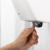 84739_katrin_system_hand_towel_roll_dispenser_with_user.png