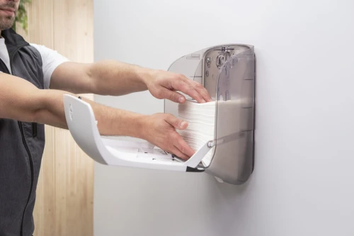 katrin_plastic_dispenser_small_for_folded_paper_hand_towels_filling_up.jpg